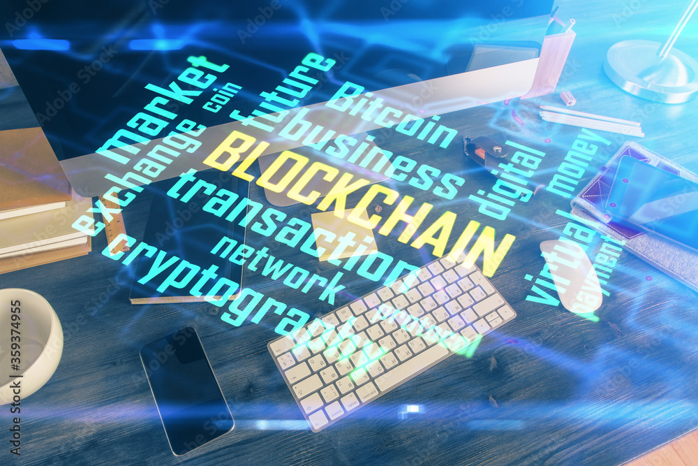 Double exposure of blockchain and crypto economy theme hologram and table with computer background. Concept of bitcoin cryptocurrency. Double exposure of blockchain and crypto economy theme hologram and table with computer background. Concept of bitcoin cryptocurrency.