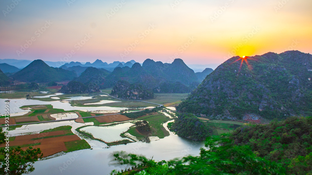Sunset View of Puzhehei, a typical karst landscape in Yunnan, China.