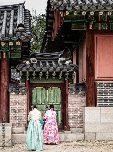 Photography Visitors wearing traditional Korean dresses at the Changdeokgung Palace