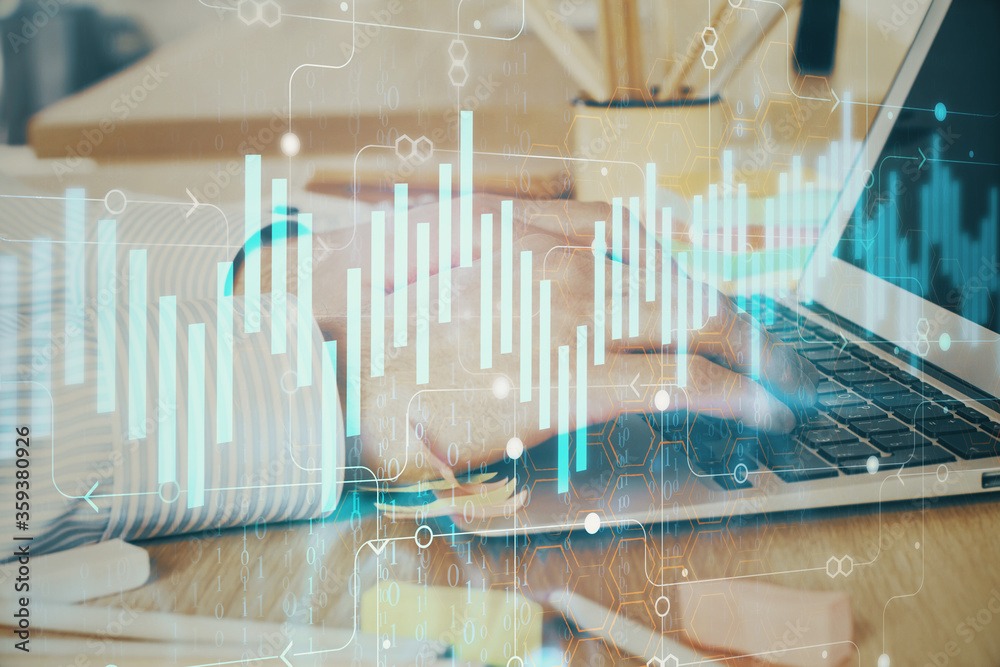Multi exposure of stock market graph with man working on laptop on background. Concept of financial analysis. Multi exposure of stock market graph with man working on laptop on background. Concept of financial analysis.