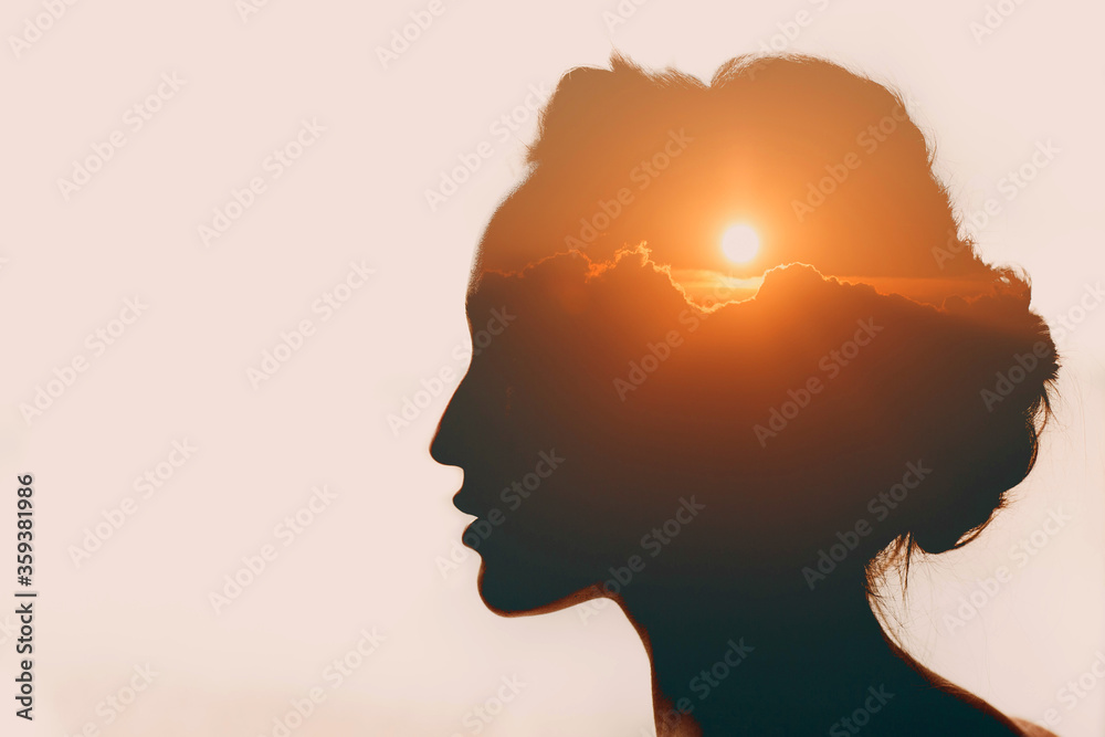 Woman with sun over clouds in her head. Mental health concept - obrazy, fototapety, plakaty 