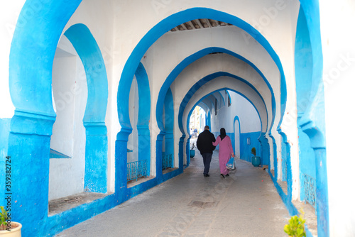 Beautiful view of street with typical arabic architecture in Asilah. Location: Asilah, North Morocco, Africa. Artistic picture. Beauty world photo