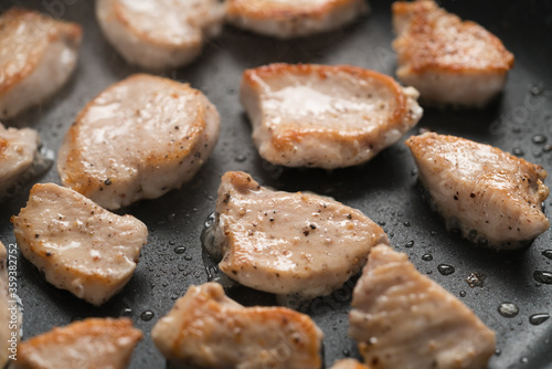 fying chicken fillet slices on nonstick pan