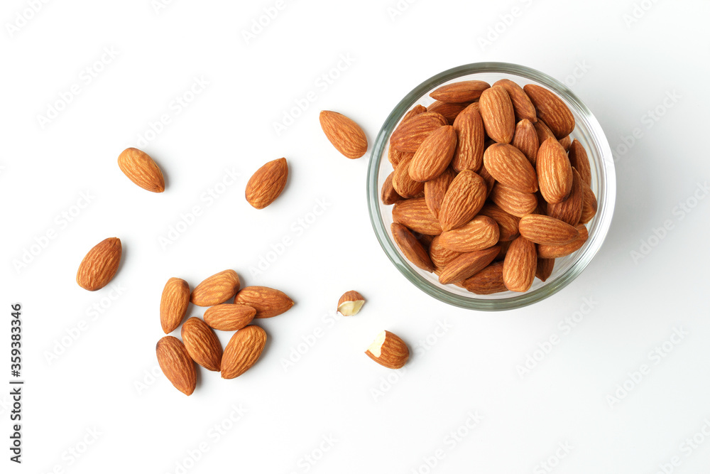 Almond in a clear cup the top corner shooting pile on the white background with clipping path suitable for product Almond in a clear cup the top corner shooting pile on the white background with clipping path suitable for product