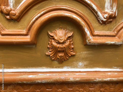 Картината върху платно Painted door with a screaming devil head