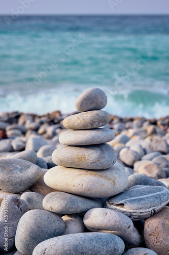 Zen balanced stones stack on beach