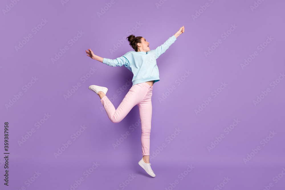 Full length body size view of her she nice attractive slim cheerful dreamy girl jumping holding invisible parasol having fun isolated violet purple lilac bright vivid shine vibrant color background