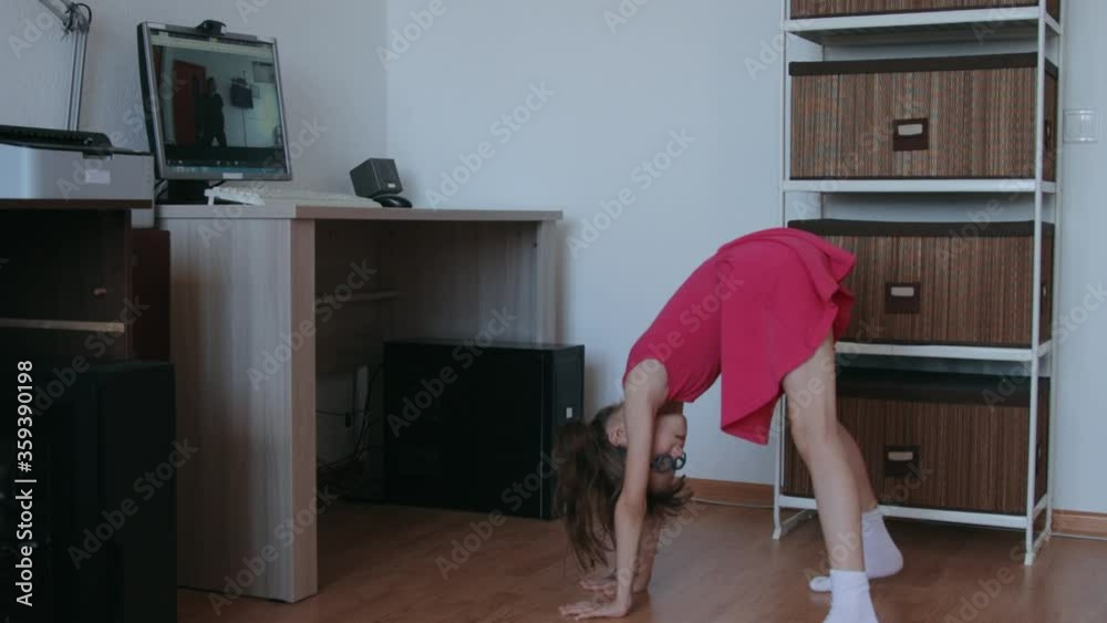 Little girl taking online classes at home during covid 19 epidemic