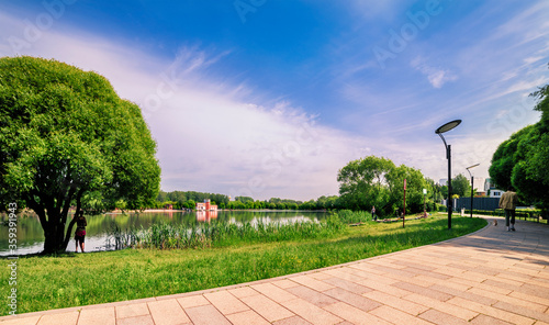 Moscow. June 16, 2020. Meshchersky Park after quarantine. People went for a walk along the shore of the pond photo