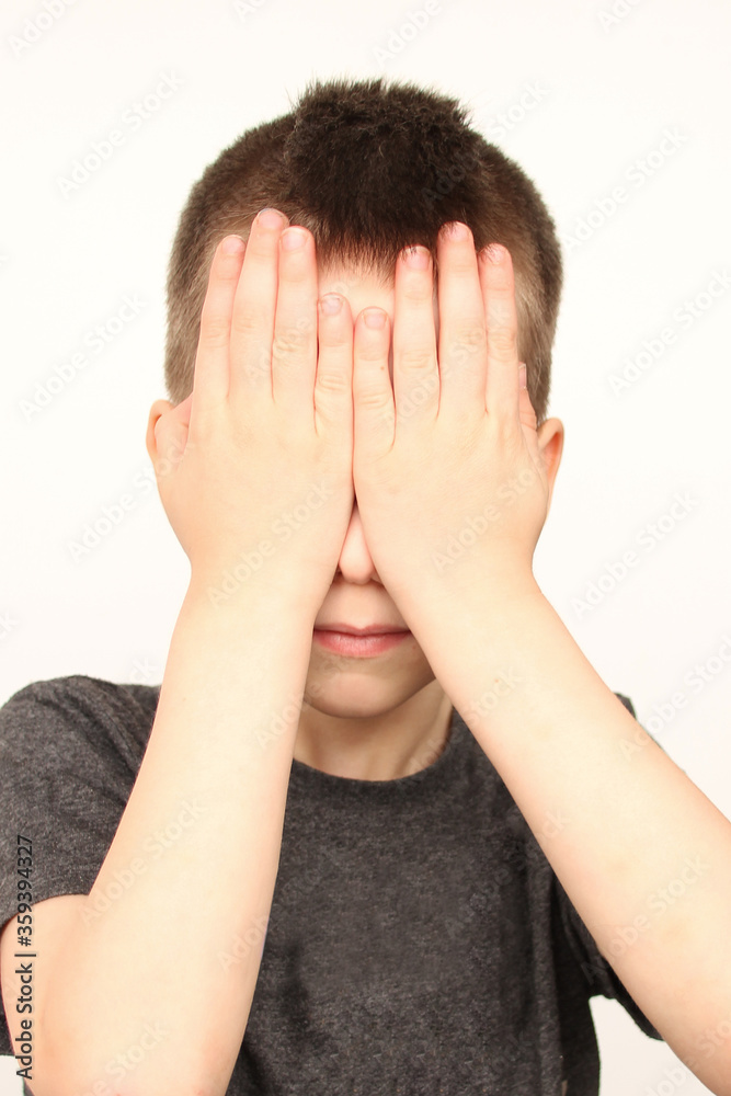 crying child, kid, covering his eyes with fear, shame or resentment, cry and afraid, concept of abuse, outsider in the children’s team, bullying, family violence crying child, kid, covering his eyes with fear, shame or resentment, cry and afraid, concept of abuse, outsider in the children’s team, bullying, family violence
