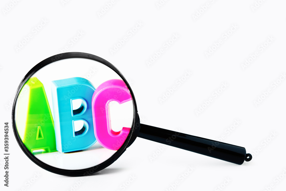 magnifying glass with letters concept search for information or study of literacy magnifying glass with letters concept search for information or study of literacy