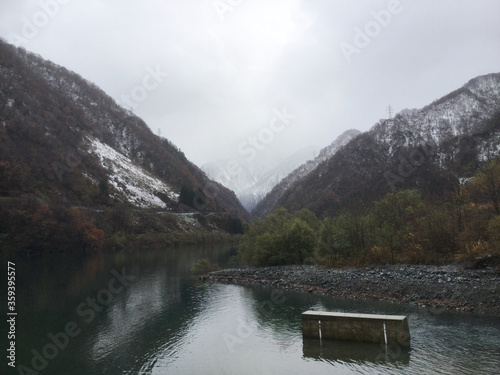 Snowy Unazuki Lake in Kurobe Gorge photo