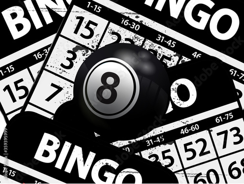 Number 8 black bingo ball over black bungo cards photo