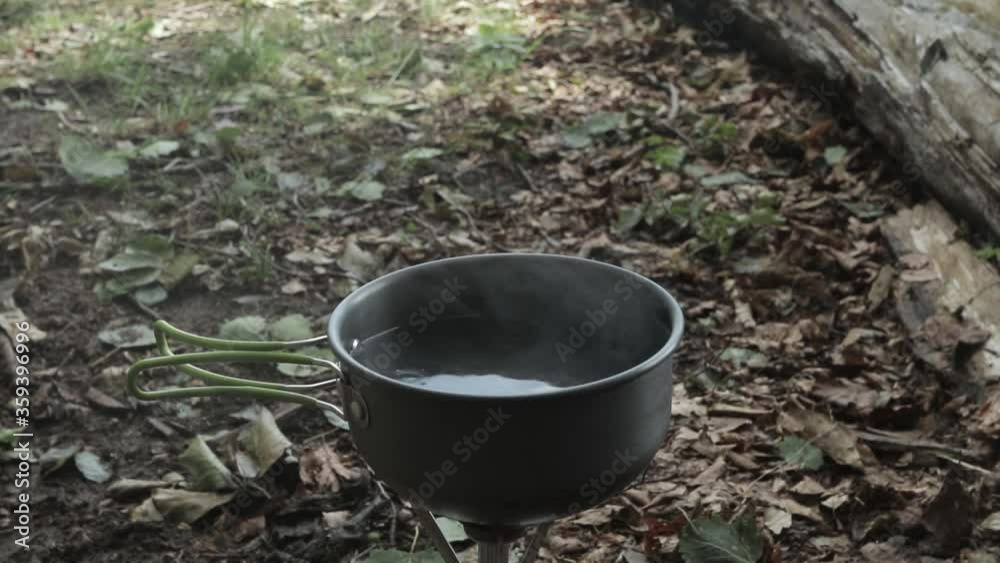 Boiling water in nature. Outdoor cooking Boiling water in nature. Outdoor cooking