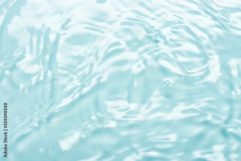 Blue clear water with fine ripples, the waves, a natural background