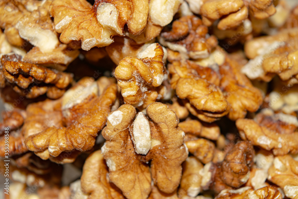 Peeled walnuts close-up. Surface texture. Healthy diet. Peeled walnuts close-up. Surface texture. Healthy diet.