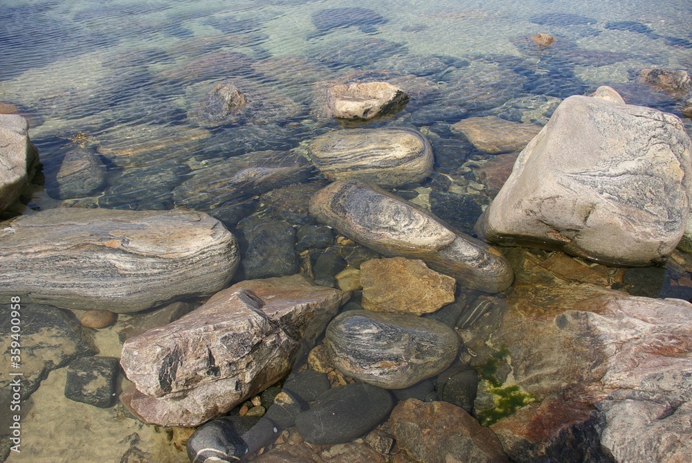 A close view of some Lewisian gneiss rocks in the sea on the Isle of Lewis, Scotland. A close view of some Lewisian gneiss rocks in the sea on the Isle of Lewis, Scotland.