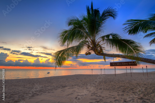 Beautiful sunset on the beach of Ko Kho Khao island with palm trees, Thailand