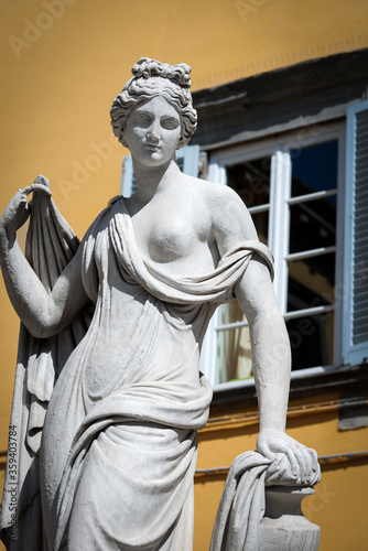 Neoclassical statue of a Naiad, 1838-1840 (called Pupporona for her exposed breast) in Piazza San Salvatore (Town square) in Lucca downtown, Tuscany, Italy. Designed by Lorenzo Nottolini and made by L photo