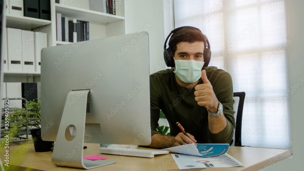 businessman wearing mask and show thumb up in office, ready to work concept businessman wearing mask and show thumb up in office, ready to work concept