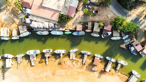  Aerial bird's eye view Liopetri river (potamos Liopetriou), Famagusta, Cyprus. Tourist attraction fishing village, fjord with colourful boats moored on banks at Kokkinochoria, Ammochostos, from above photo