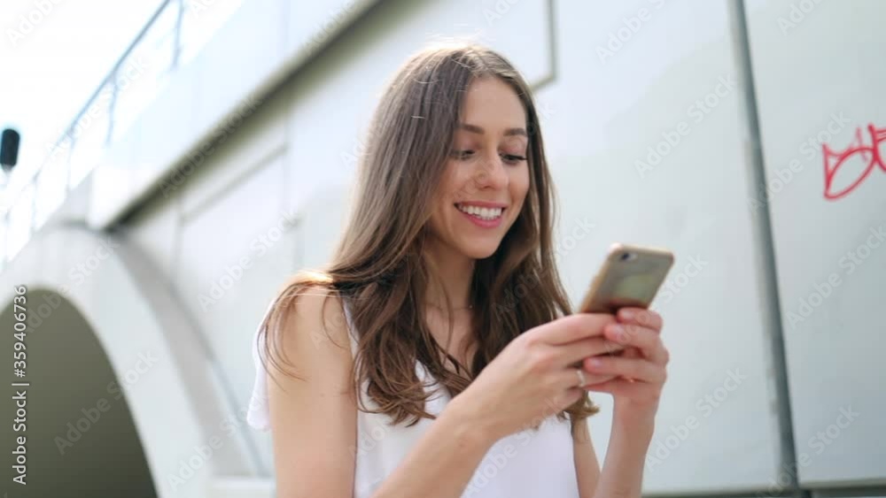 Attractive young woman using smartphone outdoors
Attractive young woman using smartphone outdoors