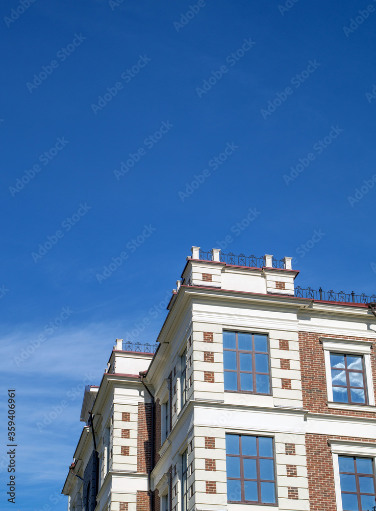 Multi-storey residential buildings against the blue sky in clear weather