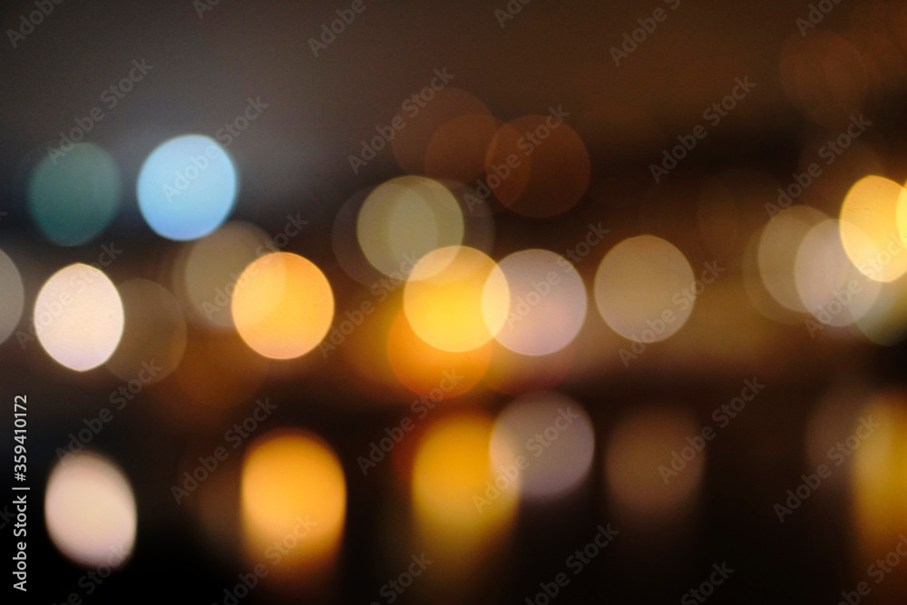 Fototapeta premium Christmas bokeh light background. Circular reflection of city light and blurred background in the night. 
