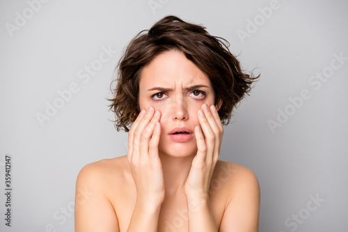 Closeup photo of beautiful naked lady bobbed hairstyle look mirror displeased touch cheekbones under eye bags overworked terrible skin condition isolated grey color background