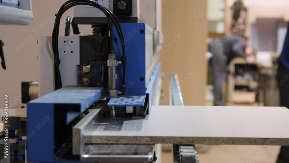 An edgebanding machine in workshop An edgebanding machine in workshop