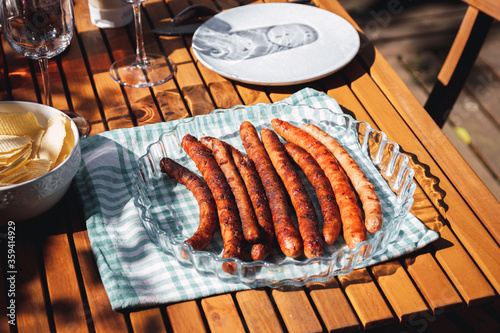 Pork chipolata. Close-up view of fried sausages. Meat dish