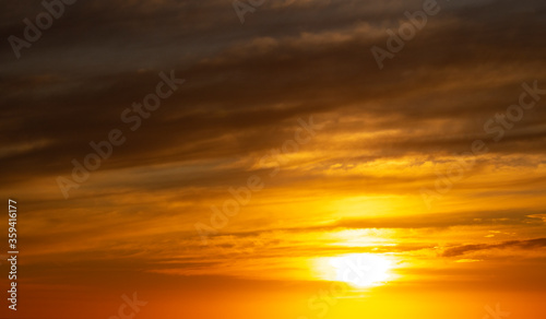 Dramatic golden sunset over the ocean. © Global News Art