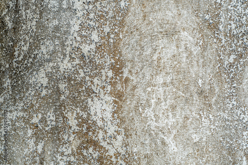 Dirty old concrete wall texture with cracks and stains - beige color
