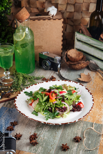 Healthy rustic garden salad of fresh vegetables photo