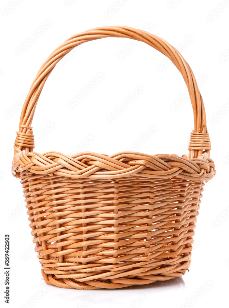 Big wicker basket on a white background. The basket is made of vines.