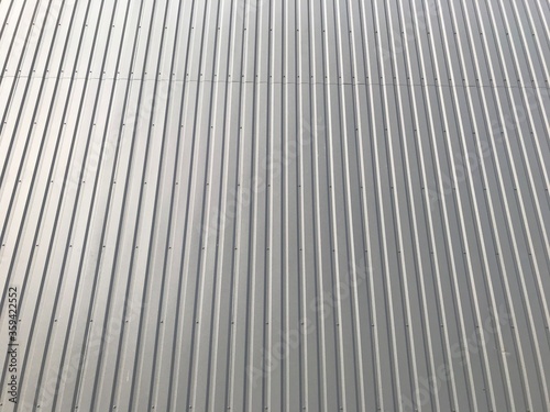 background texture of the facade of the building made of gray metal sheets