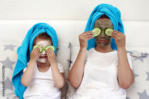 Mother and daughter in spa. Mother and daughter are having a face mask