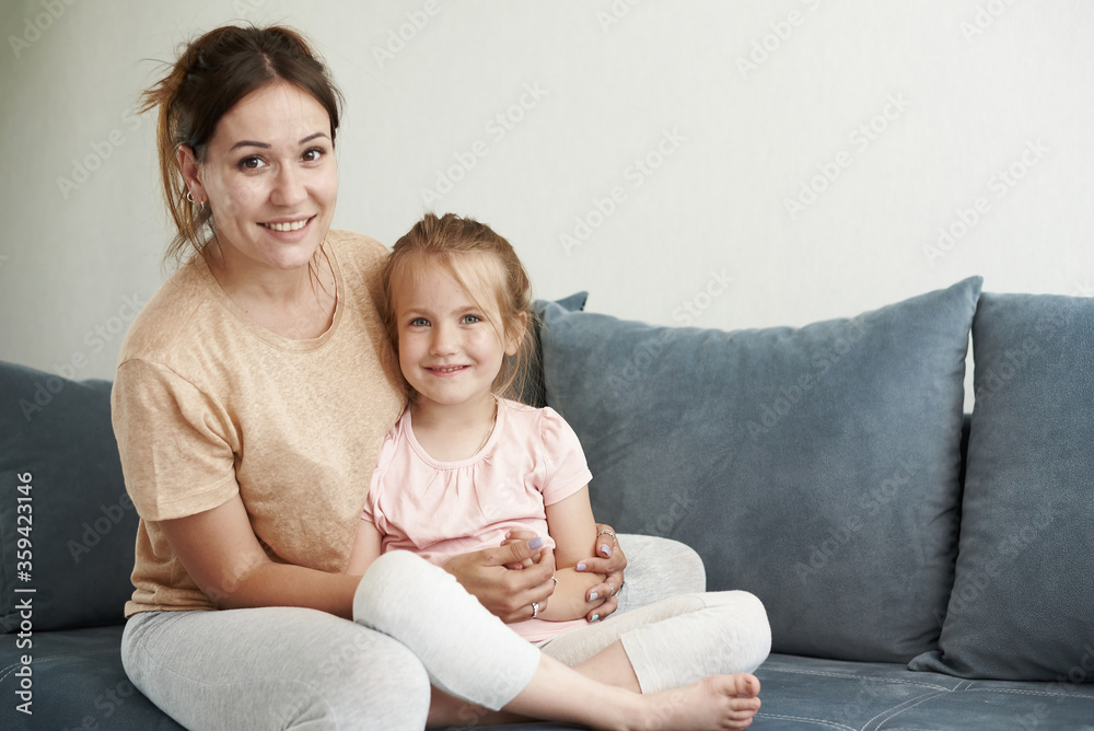 Mother and daughter are smiling. Mother and daughter are hugging and laughing. Mother and daughter are smiling. Mother and daughter are hugging and laughing.