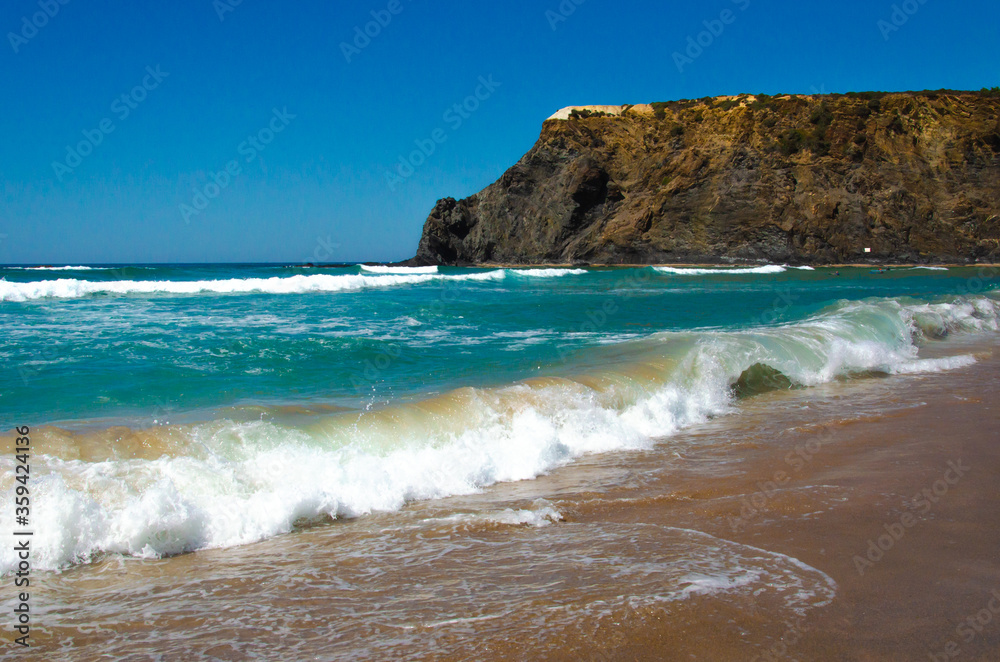 beautiful view of the beach coast of the Atlantic ocean in Portugal. Tourism and recreation. Waves break on the shore, banner.