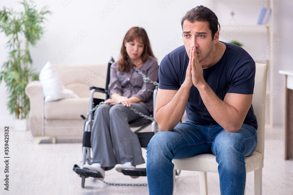 Disabled wife and young husband at home Disabled wife and young husband at home