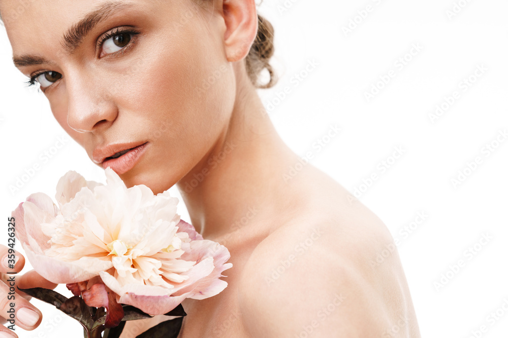 Image of beautiful caucasian young shirtless woman holding peony flower Image of beautiful caucasian young shirtless woman holding peony flower