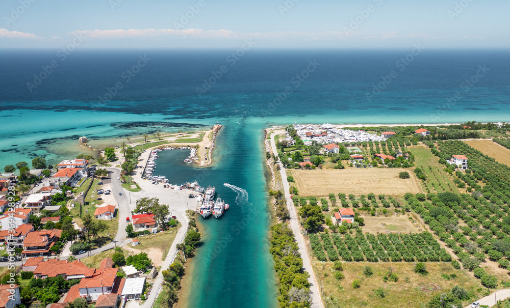 Aerial view at Nea Potidea canal, which connects Toroneos Bay with the Gulf of Thermaikos. Greece, Kassandra, Halkidiki