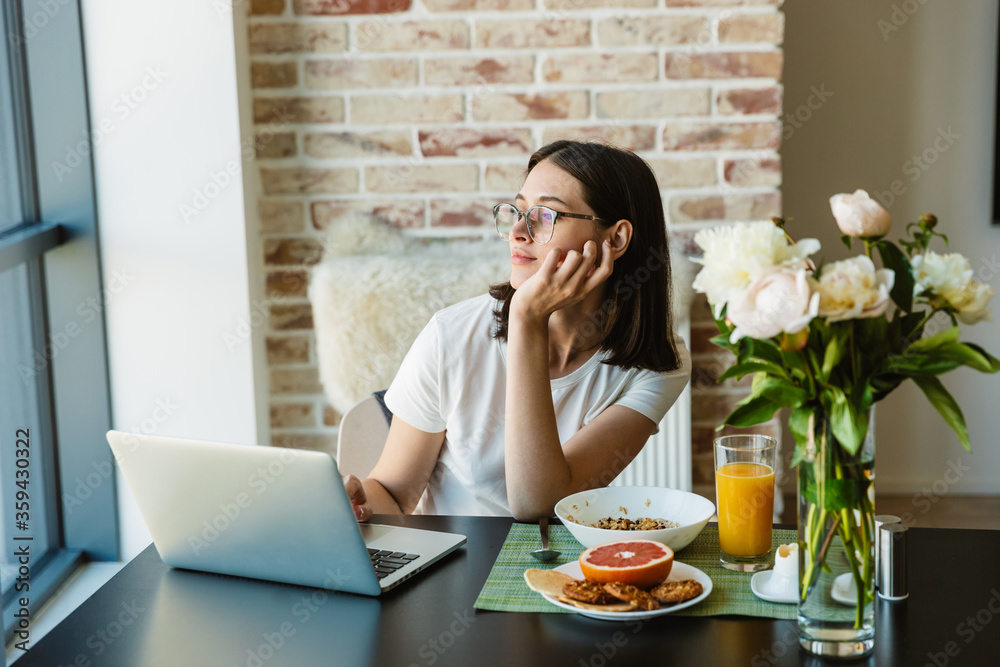 Attractive young lovely brunette woman using laptop computer