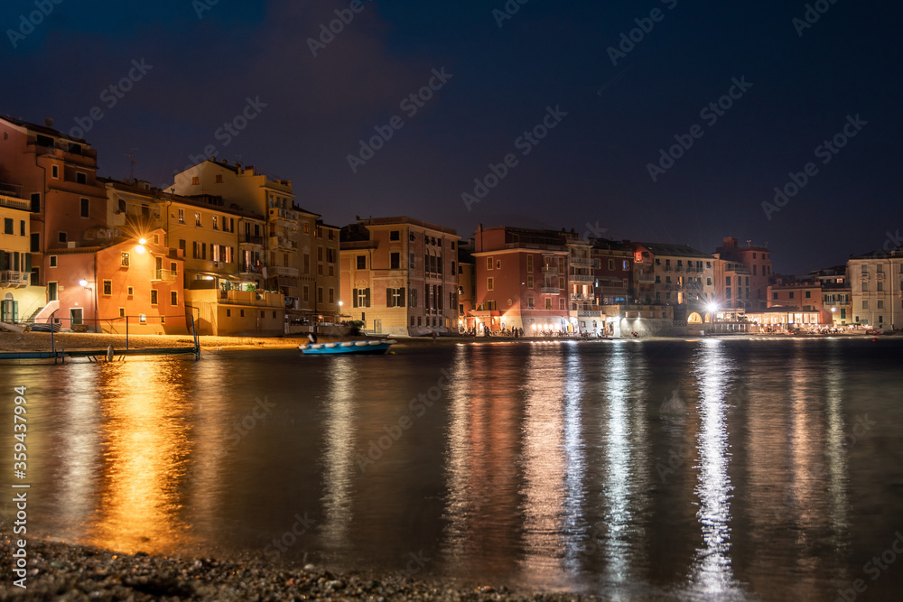 Panoramic night view of beatiful sea resort town. Romantic vacation. Italy, Sestri Levante, Bay of Silence