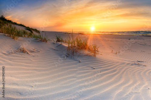 Fototapeta Naklejka Na Ścianę i Meble -  Beautiful summer sunset over beach at Baltic sea