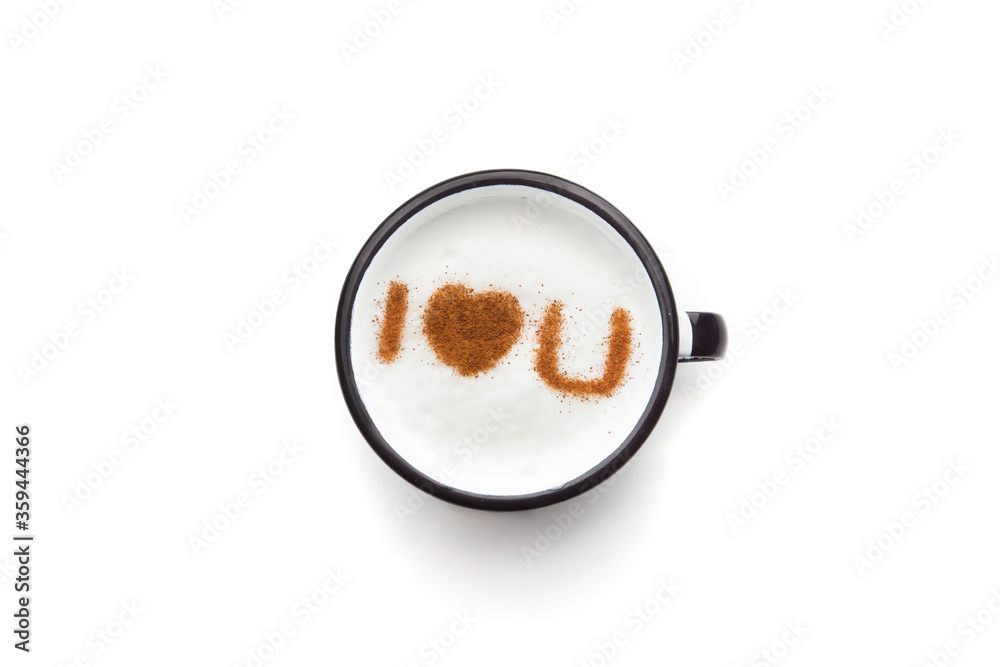 A rustic mug with coffee cream. Food art creative concept image, drawing with cinnamon powder over cream in a white background.
A rustic mug with coffee cream. Food art creative concept image, drawing with cinnamon powder over cream in a white background.