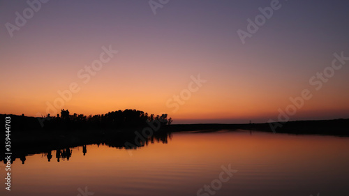 Beautiful landscape of sunset reflected on a lake on summer