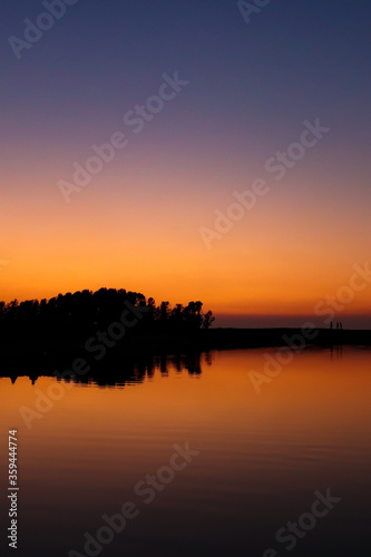 Beautiful landscape of sunset reflected on a lake on summer