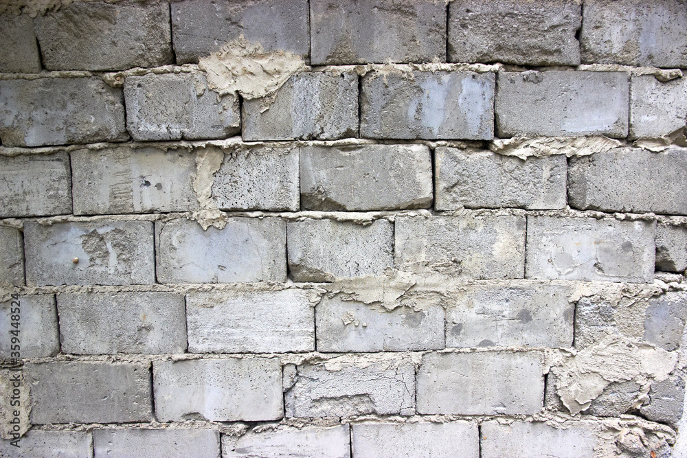 Fototapeta premium masonry old foam concrete wall with traces of masonry mortar