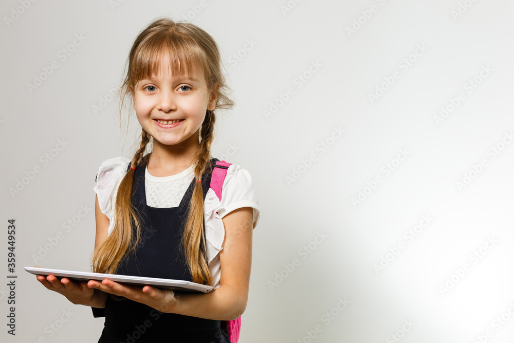 Little Funny girl in shirt. Isolated on white background. Baby girl in school. The child girl with textbooks. Girl studing. Little Funny girl in shirt. Isolated on white background. Baby girl in school. The child girl with textbooks. Girl studing.